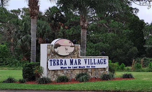 a view of sign board and yard