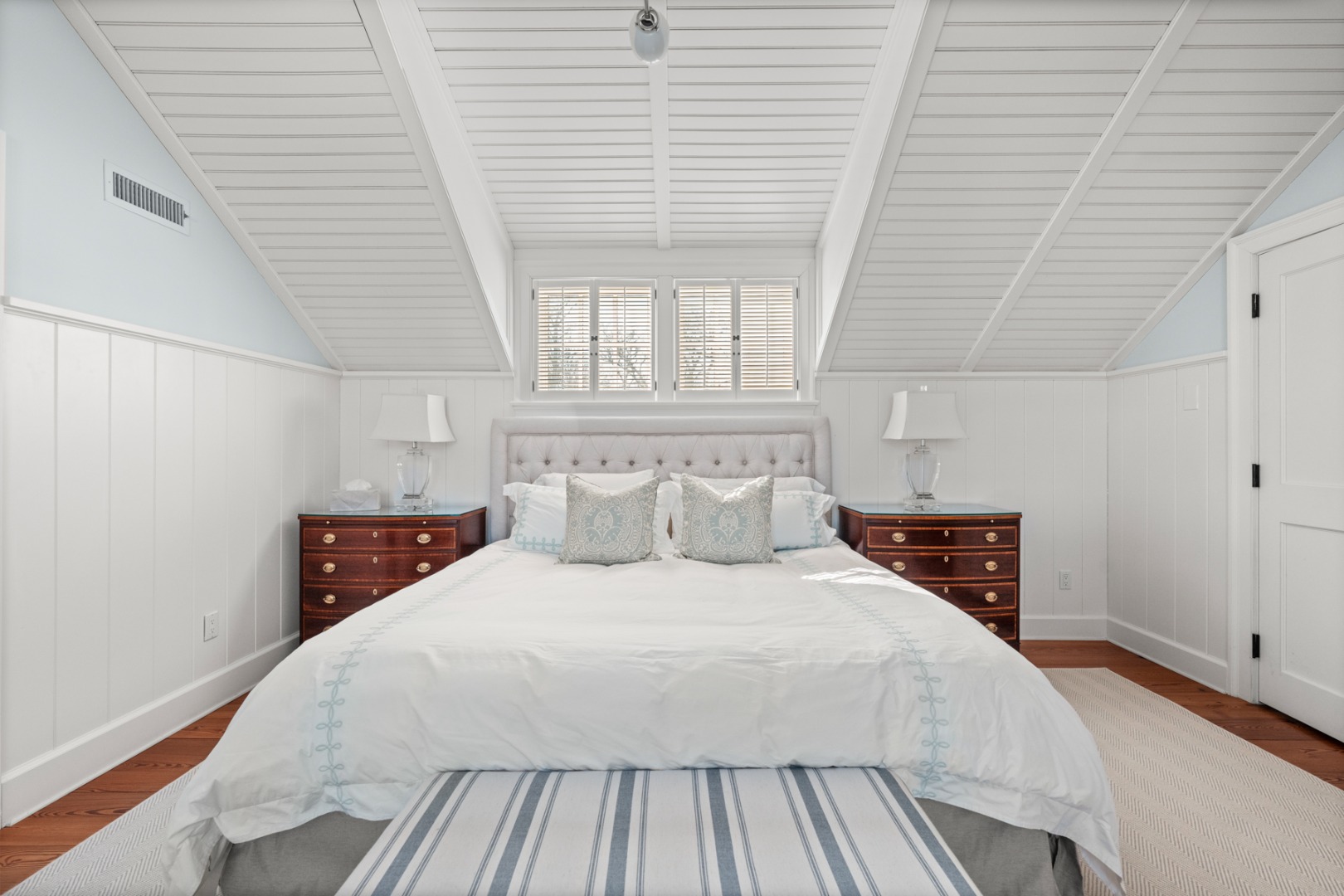 18 Mill Street Nantucket, MA 02554 - Photo 20 of 47 a bedroom with a large bed and a window