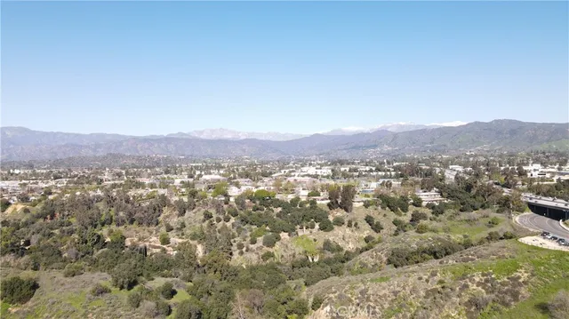 an aerial view of residential house and green space