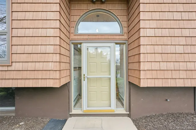 a view of a brick house with a window