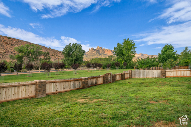 101 Chuckwalla Lane Springdale, UT 84767 - Photo 37 of 51 Fenced backyard with a view of countryside and a mountain view