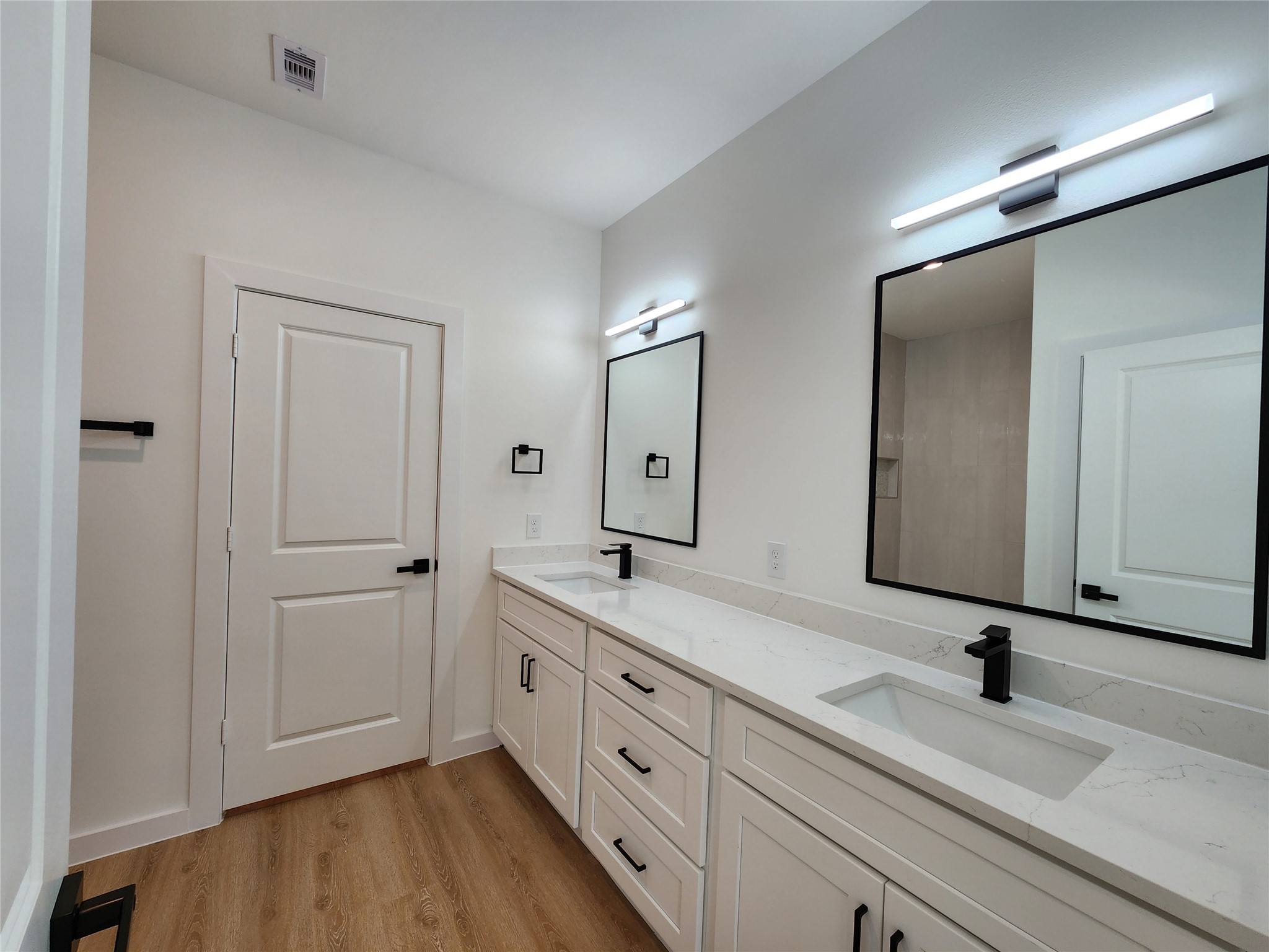7817 Beckley Street, Unit B Almont, CO 81210 - Photo 13 of 18 a spacious bathroom with a double vanity sink and mirror
