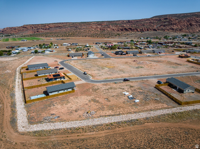 212 Lidia Circle, Unit 17 Moab, UT 84532 - Photo 4 of 24 Expansive desert landscape featuring numerous residential plots, some with newly constructed homes