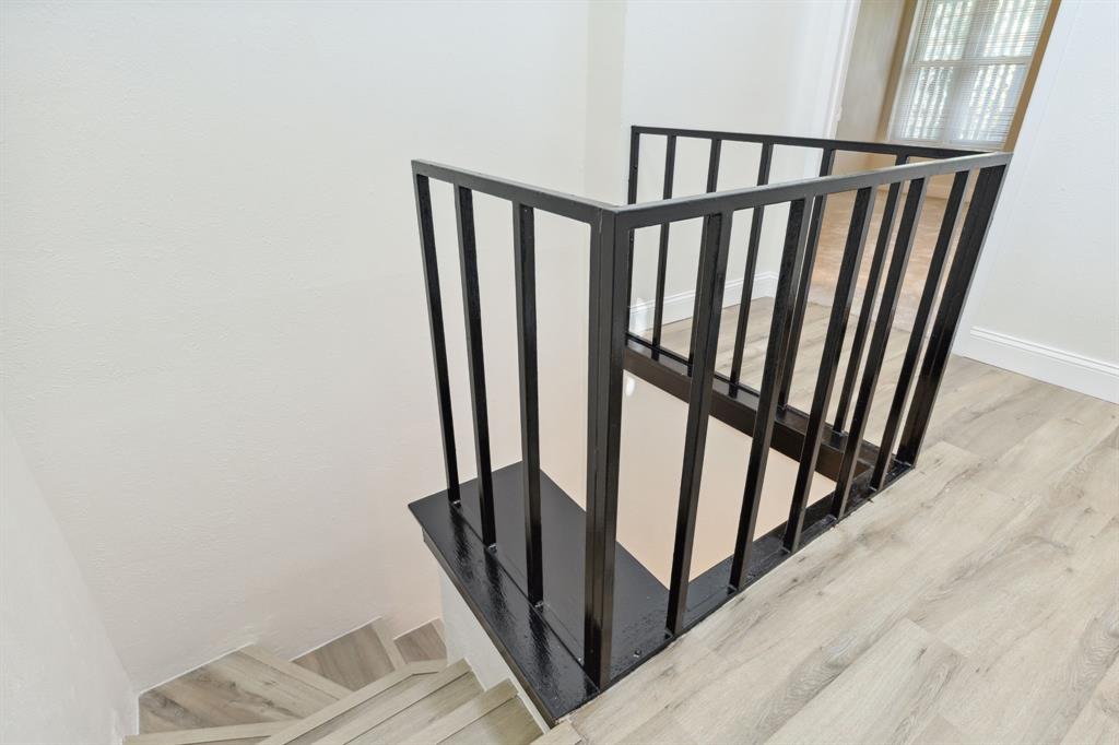 3827 Gilbert Avenue, Unit 214 Dallas, TX 75219 - Photo 14 of 25 a view of staircase with rug floor