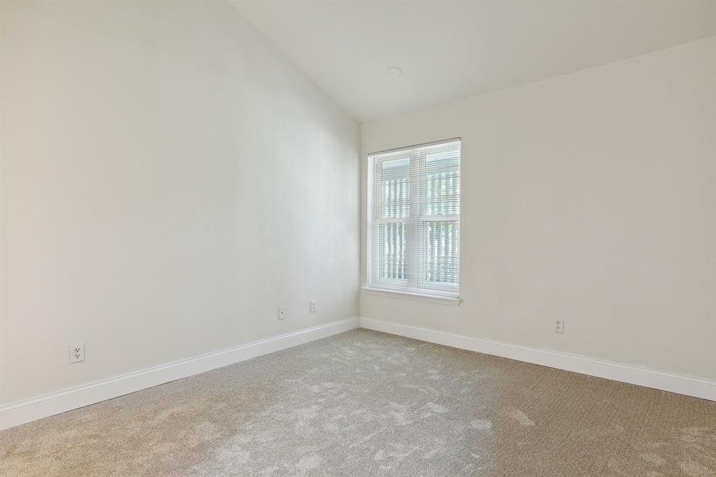 3827 Gilbert Avenue, Unit 214 Dallas, TX 75219 - Photo 15 of 25 an empty room with windows
