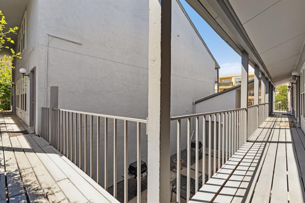 3827 Gilbert Avenue, Unit 214 Dallas, TX 75219 - Photo 22 of 25 a view of wooden balcony