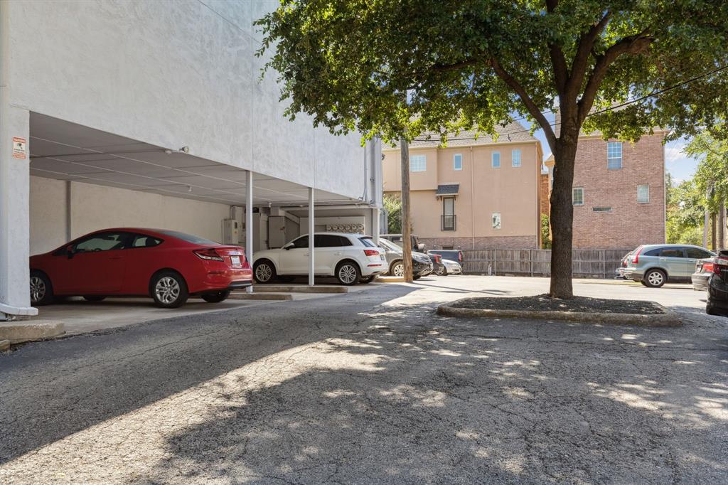3827 Gilbert Avenue, Unit 214 Dallas, TX 75219 - Photo 23 of 25 a car parked in front of a building