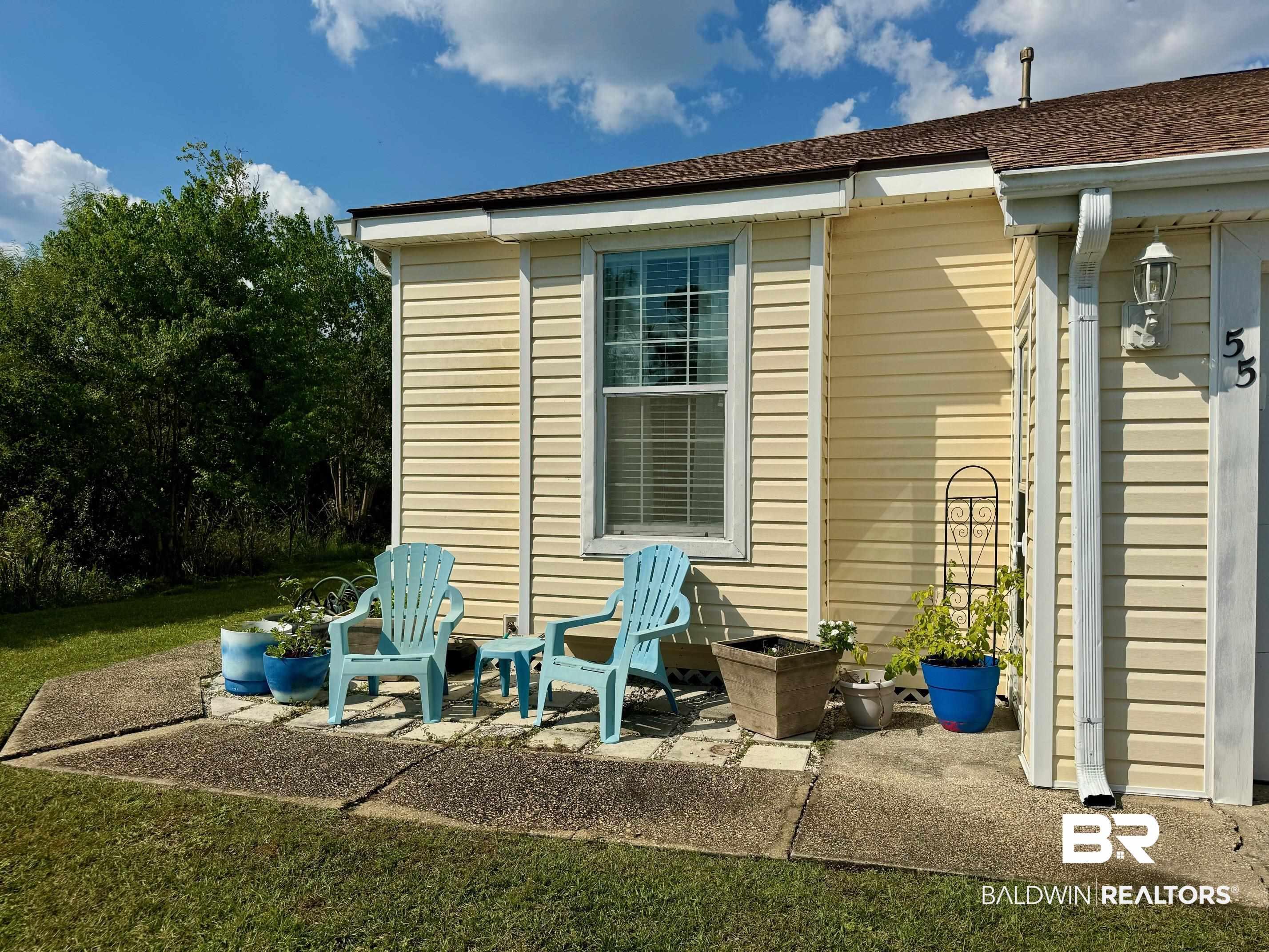 3200 Loop Road, Unit 55 Orange Beach, AL 36561 - Photo 27 of 40 Exterior space featuring a lawn