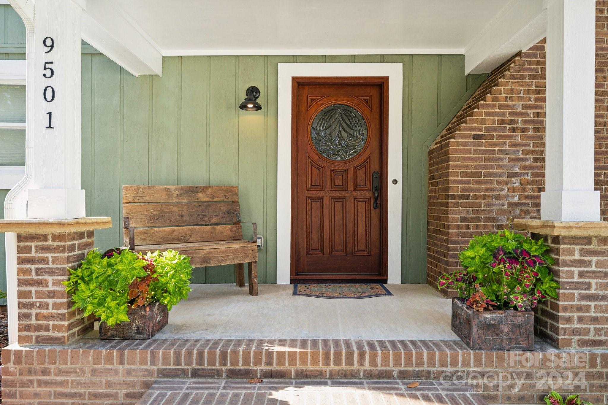 9501 Bartlett Road Mint Hill, NC 28227 - Photo 2 of 46 a front view of a house with potted plants