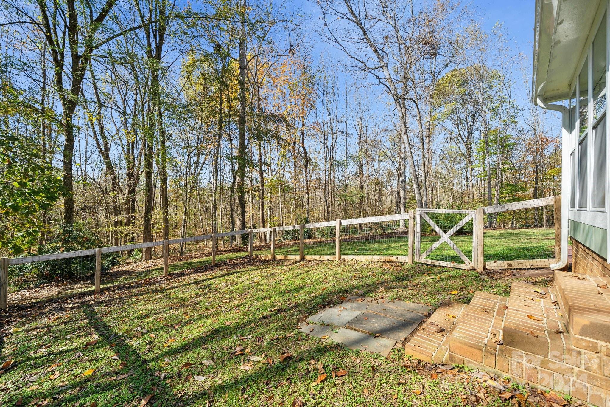 9501 Bartlett Road Mint Hill, NC 28227 - Photo 36 of 46 a view of a backyard with chairs