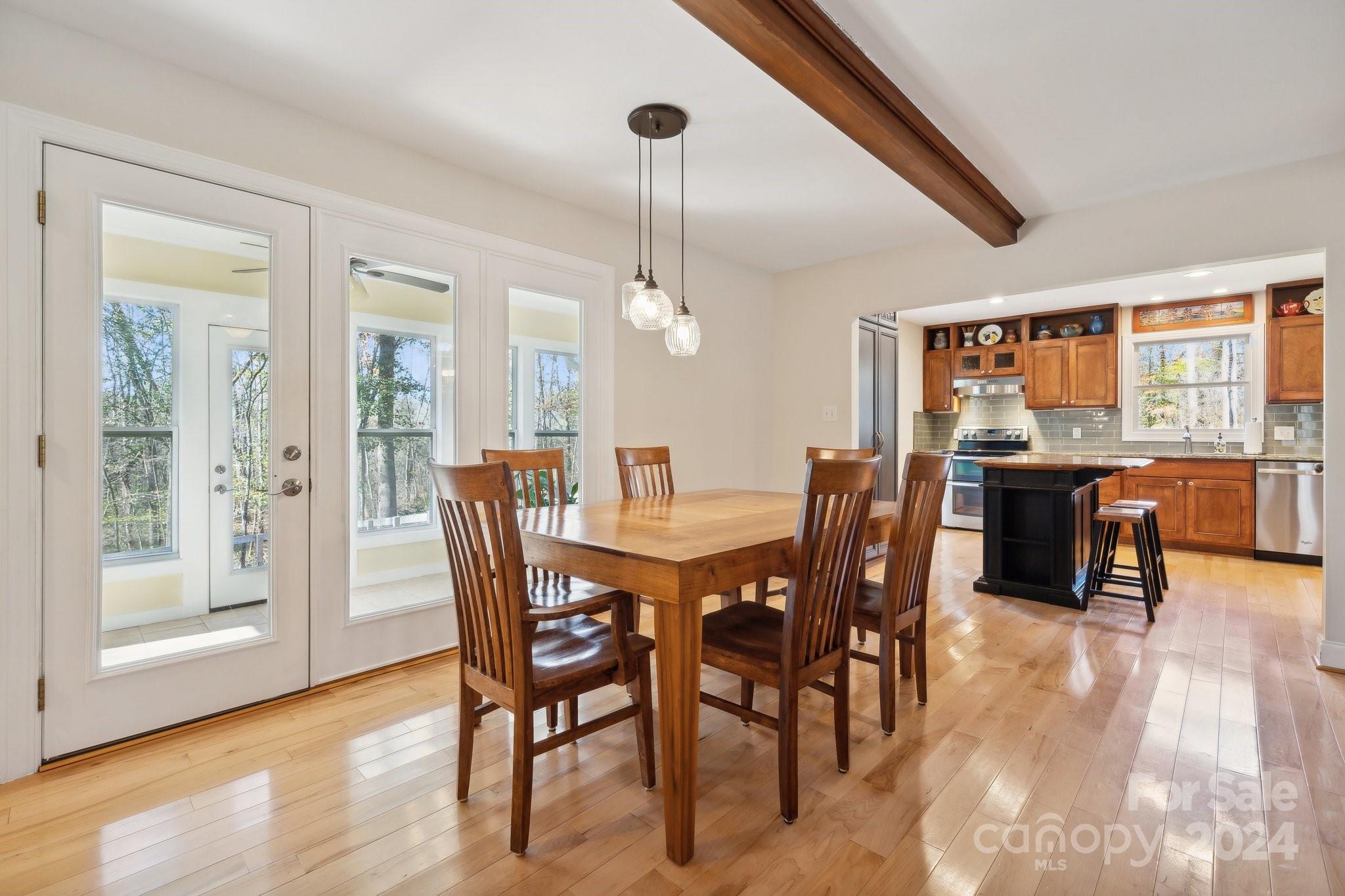 9501 Bartlett Road Mint Hill, NC 28227 - Photo 6 of 46 a view of a dining room with furniture window and wooden floor