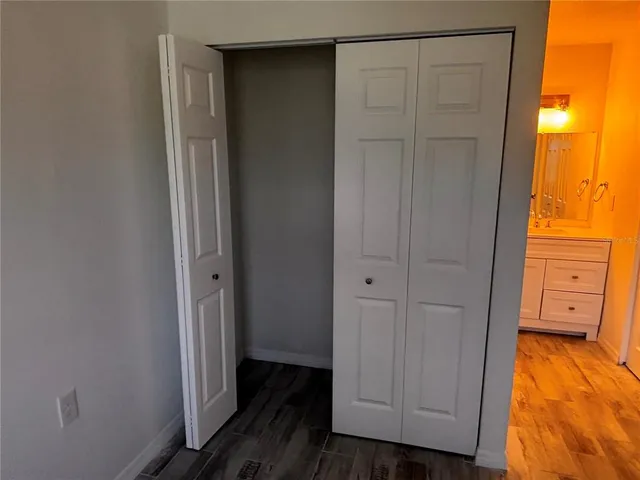 a bathroom with a double vanity sink and mirror