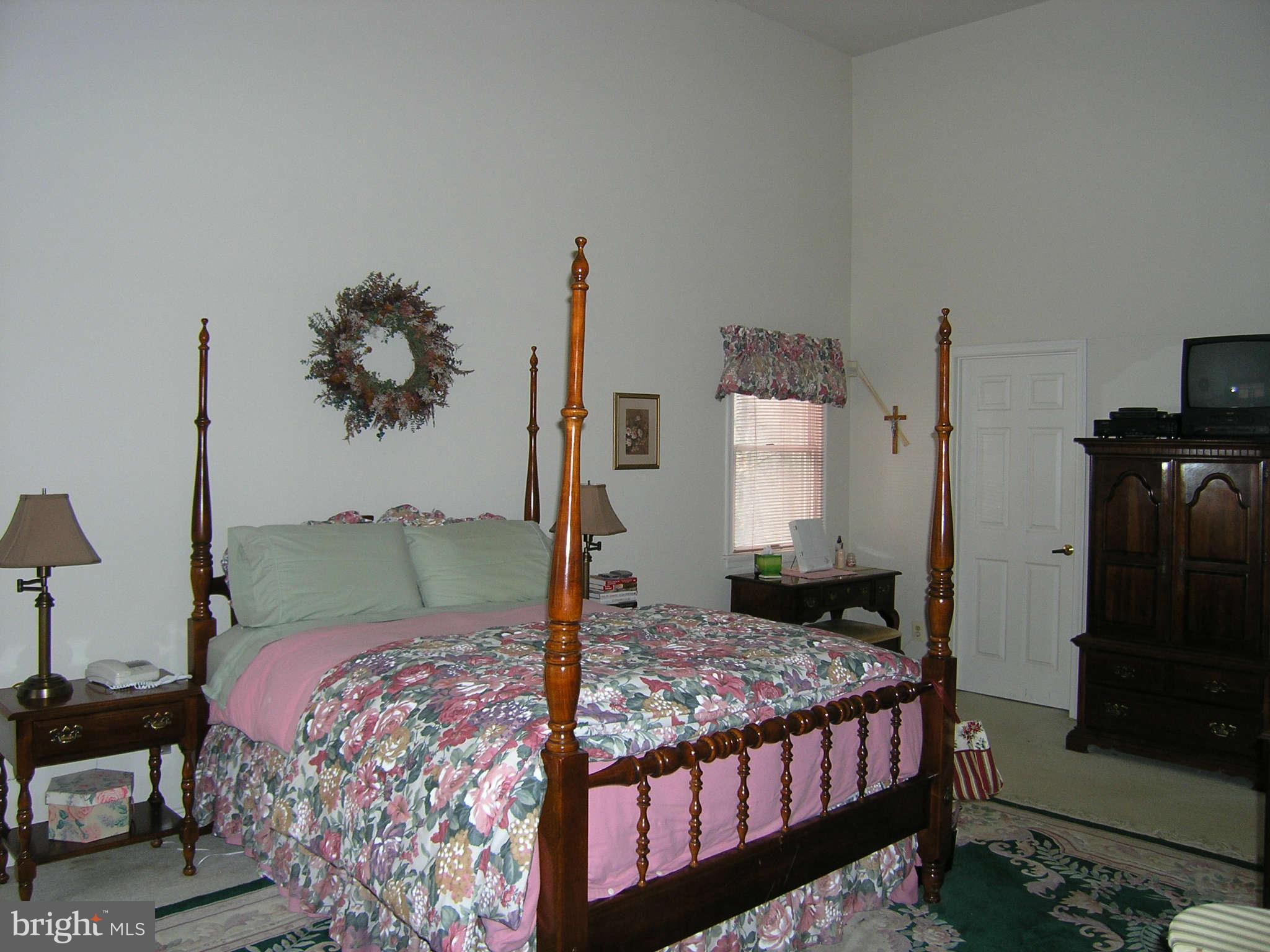 3758 Houcks Road Monkton, MD 21111 - Photo 8 of 13 a bedroom with a bed and wooden floor