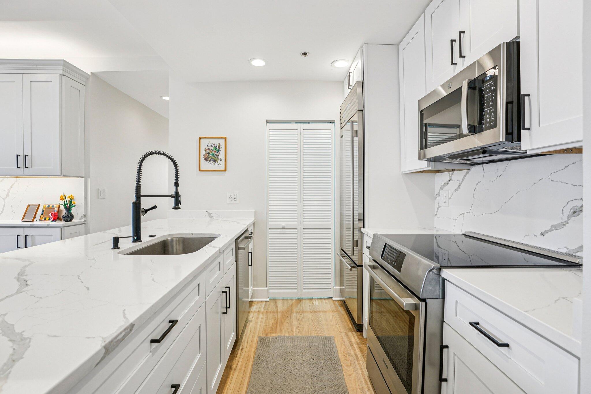 234 North Broadway, Unit 510 Milwaukee, WI 53202 - Photo 20 of 49 Kitchen with Laundry Room Doors