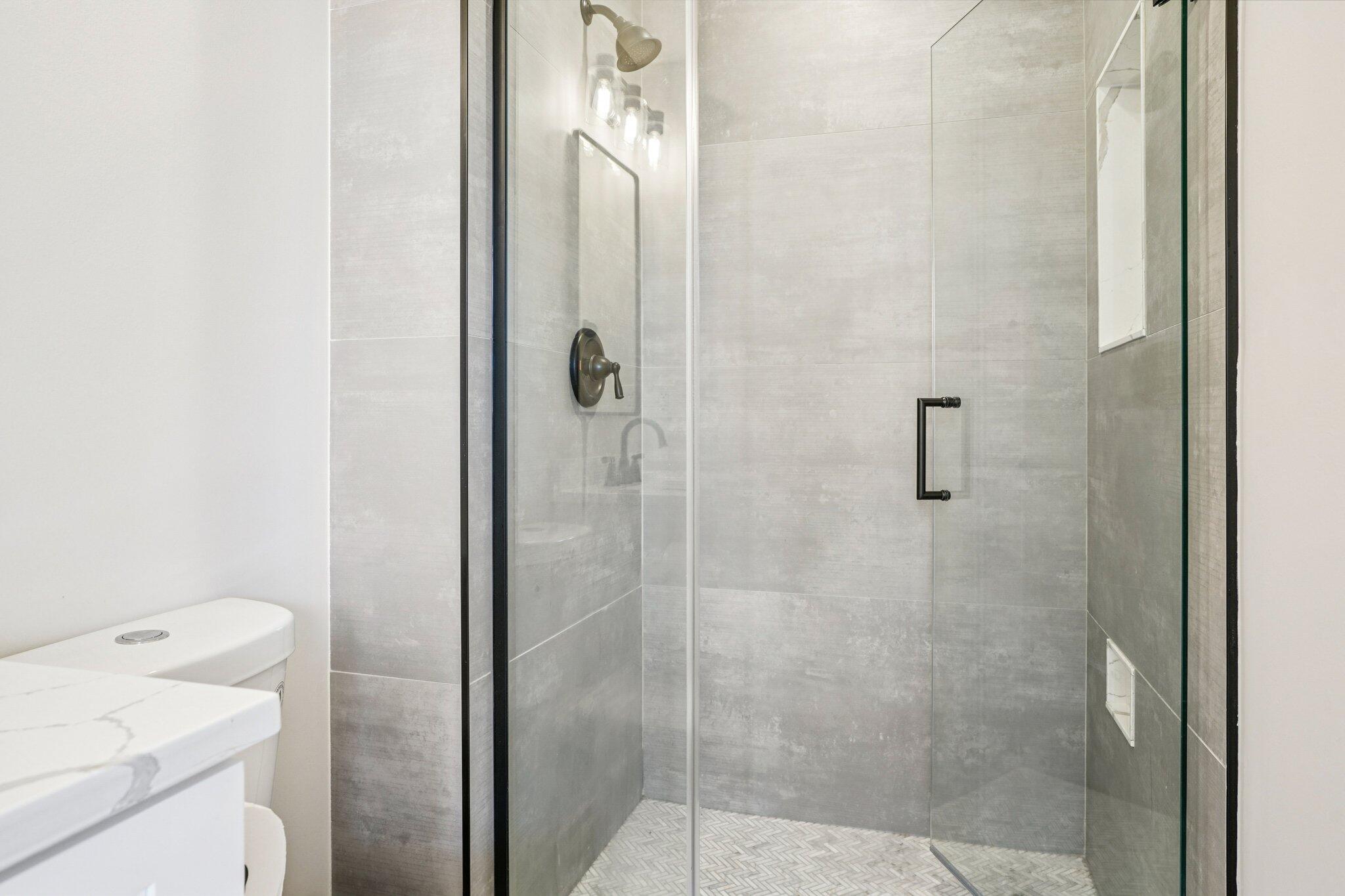 234 North Broadway, Unit 510 Milwaukee, WI 53202 - Photo 33 of 49 Primary Bathroom Walk-In Shower