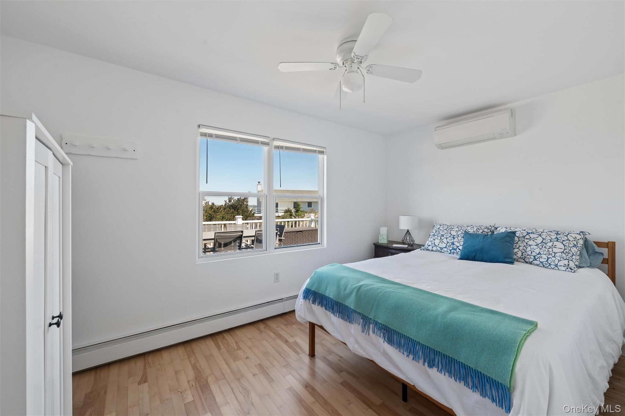 898 Dune Road Westhampton Beach, NY 11978 - Photo 16 of 36 a bedroom with a bed and window
