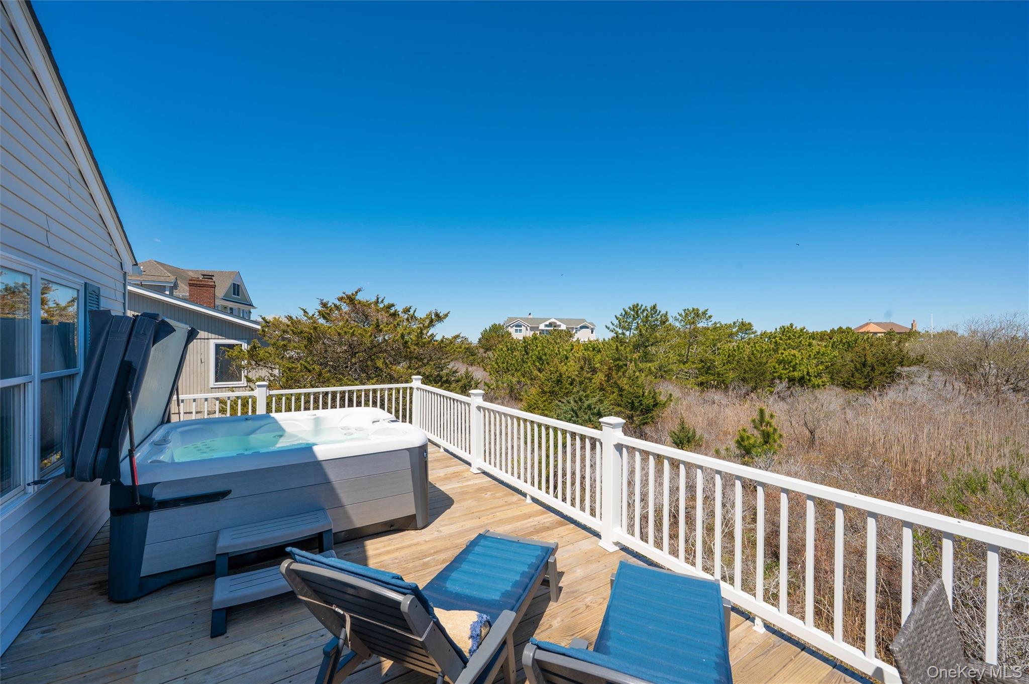 898 Dune Road Westhampton Beach, NY 11978 - Photo 29 of 36 a view of a two chairs on the roof deck
