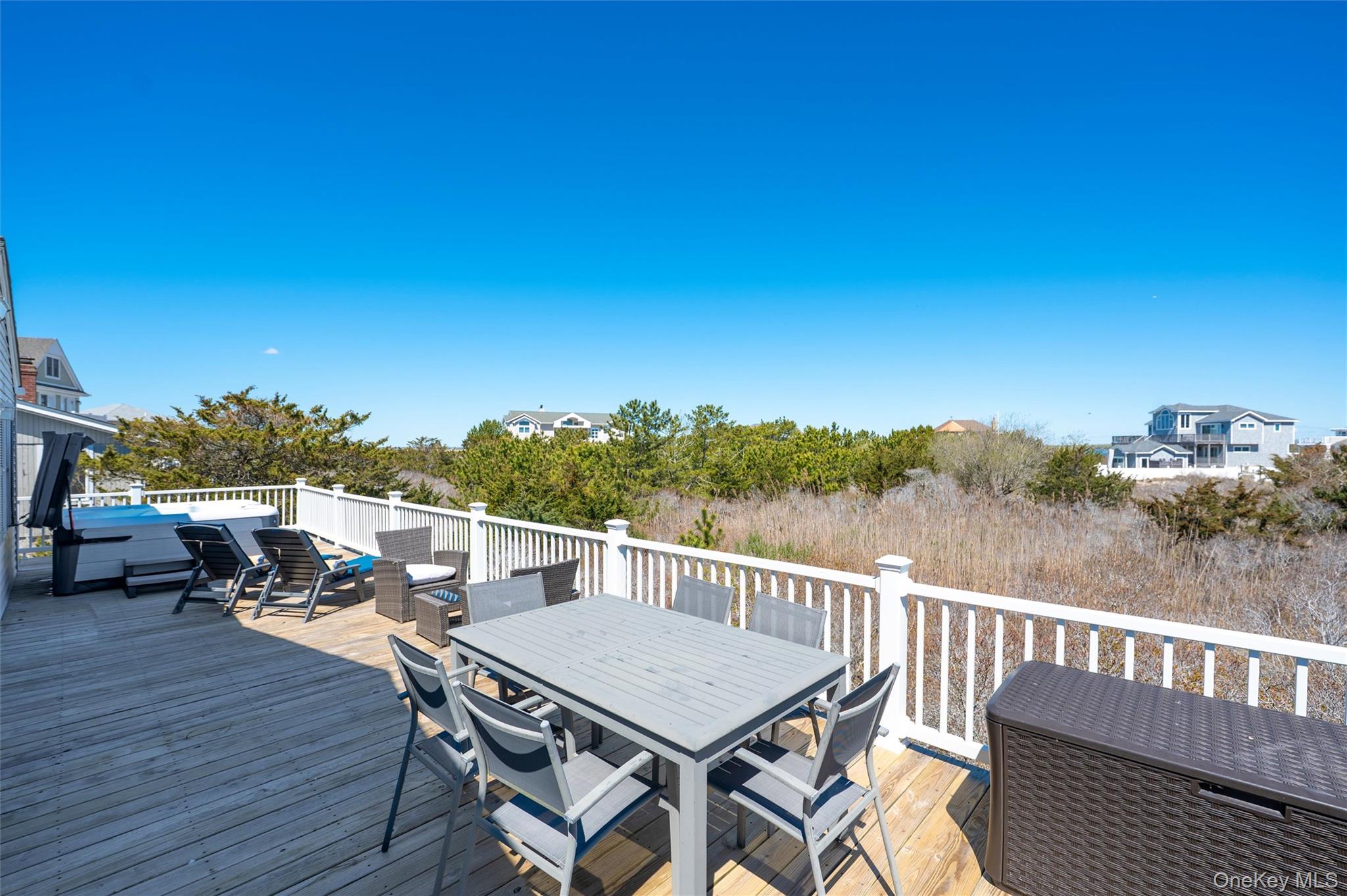 898 Dune Road Westhampton Beach, NY 11978 - Photo 32 of 36 a view of a balcony with chairs