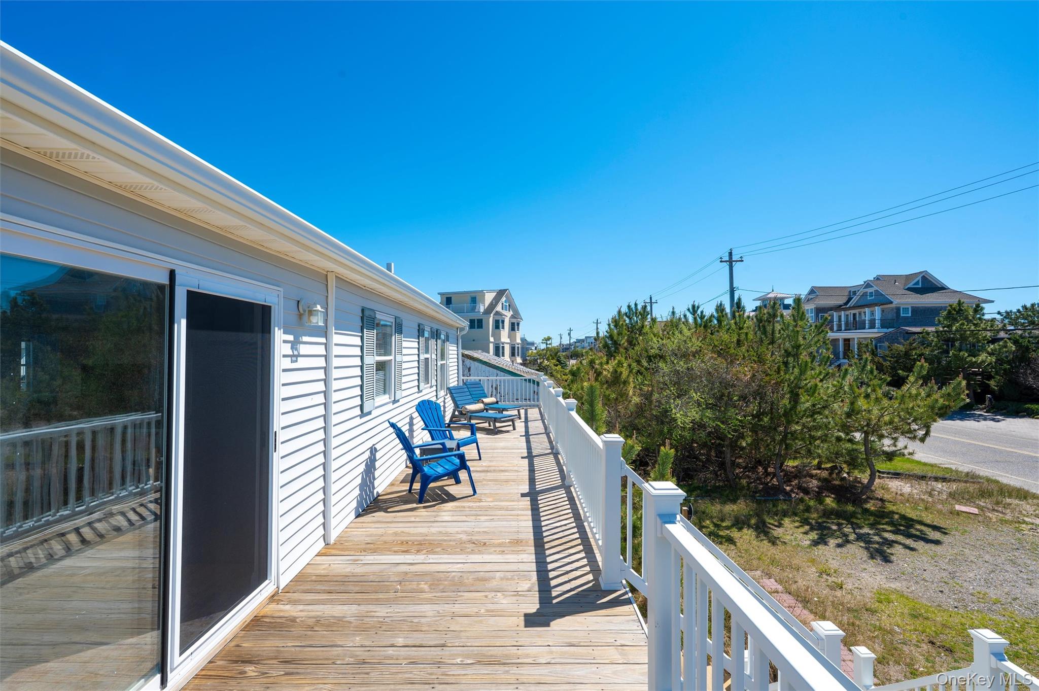 898 Dune Road Westhampton Beach, NY 11978 - Photo 34 of 36 a view of a balcony with chairs