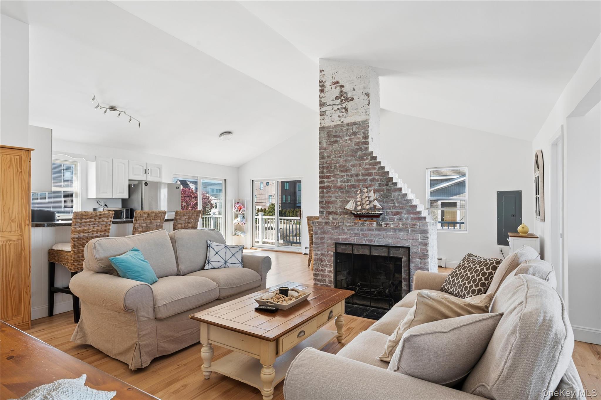 898 Dune Road Westhampton Beach, NY 11978 - Photo 5 of 36 a living room with furniture and a fireplace