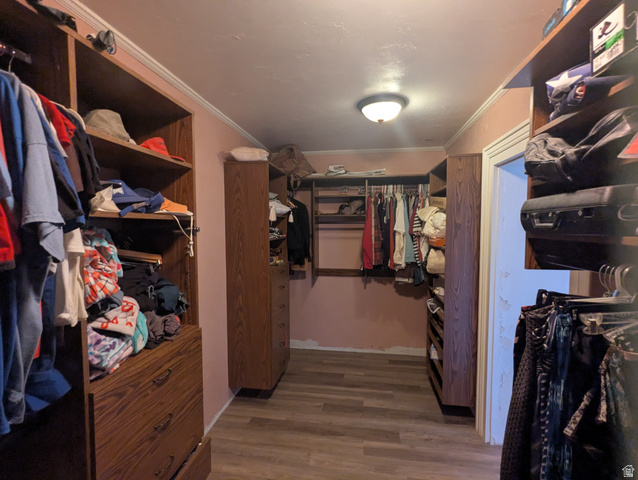 190 North 200 E Street Beaver, UT 84713 - Photo 26 of 40 Master custom closet system featuring wood-finish cabinetry and shelving