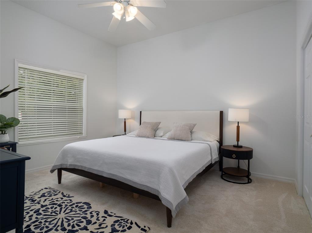 14335 North US Highway 441 Citra, FL 32113 - Photo 19 of 40 a bedroom with a bed and a lamp