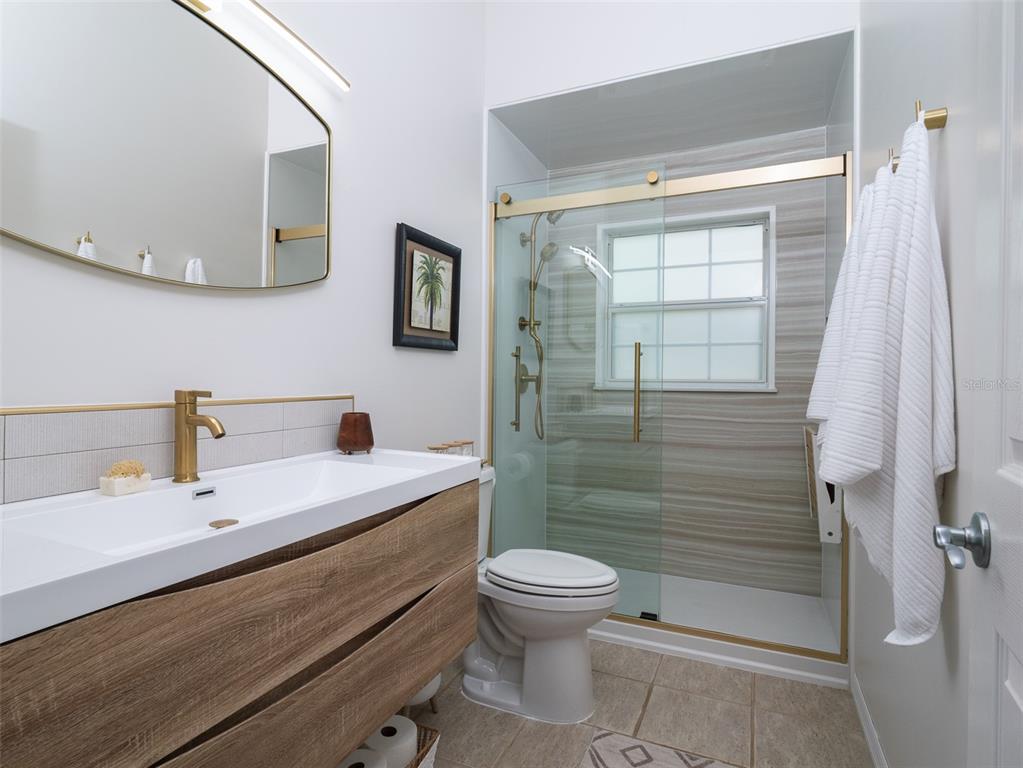14335 North US Highway 441 Citra, FL 32113 - Photo 20 of 40 a bathroom with a sink a toilet and shower