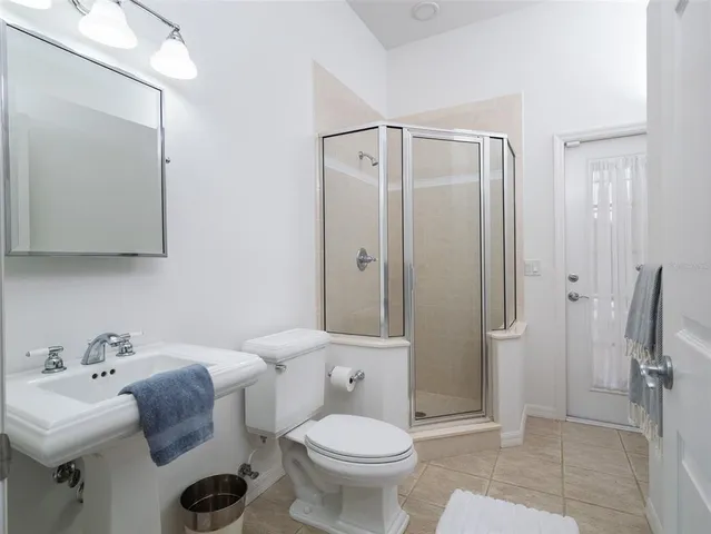 a view of swimming pool with seating area and trees around