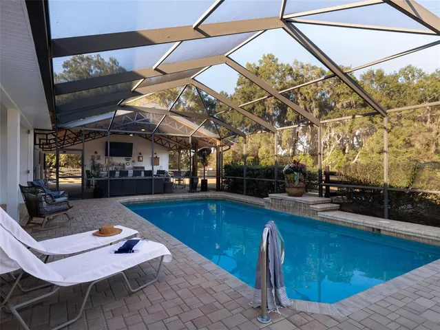a view of a yard with table and chairs
