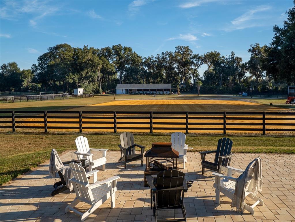 14335 North US Highway 441 Citra, FL 32113 - Photo 26 of 40 a view of swimming pool with seating area and trees around