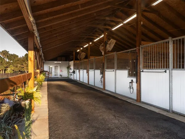 a view of a workspace with furniture and a flat screen tv
