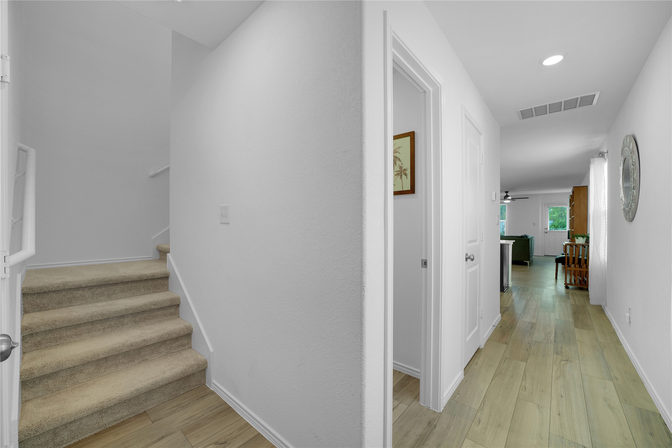 36 Trinity Circle Lockhart, TX 78644 - Photo 8 of 36 a view of a hallway with wooden floor and entryway