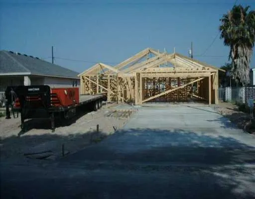 a view of a house with roof deck front of house