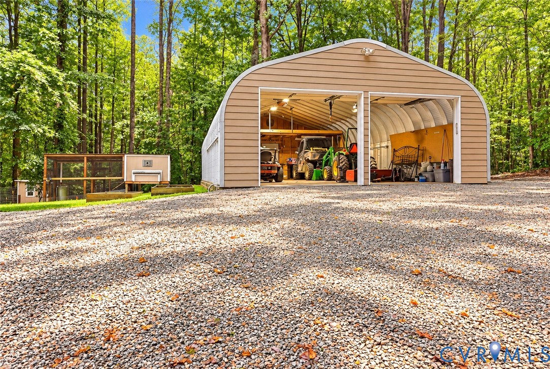 5369 Old Buckingham Road Powhatan, VA 23139 - Photo 6 of 28 Two-bay metal garage with roll-up doors, gravel dr