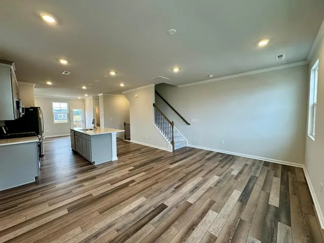 a view of kitchen with cabinets washer and dryer