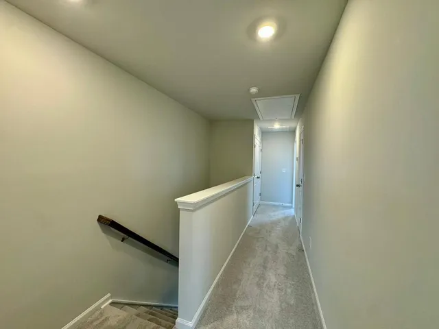 a view of a hallway with stairs