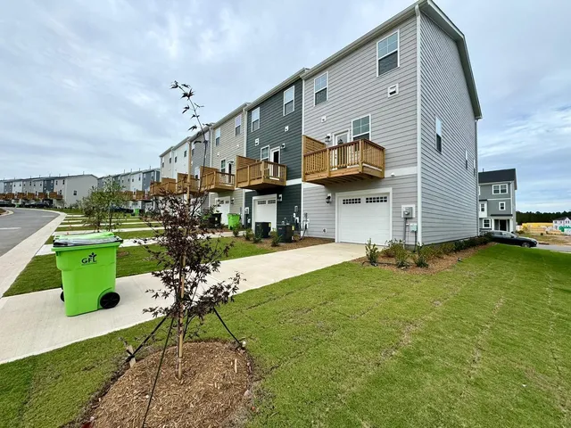 a view of a house with a back yard