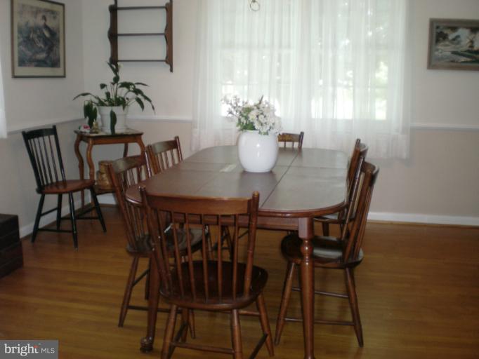 6522 Redgate Circle Baltimore, MD 21228 - Photo 3 of 19 Freshly painted with exposed hardwood
