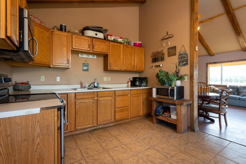 23220 Bliss Road Sprague River, OR 97639 - Photo 8 of 35 a kitchen with cabinets and chairs