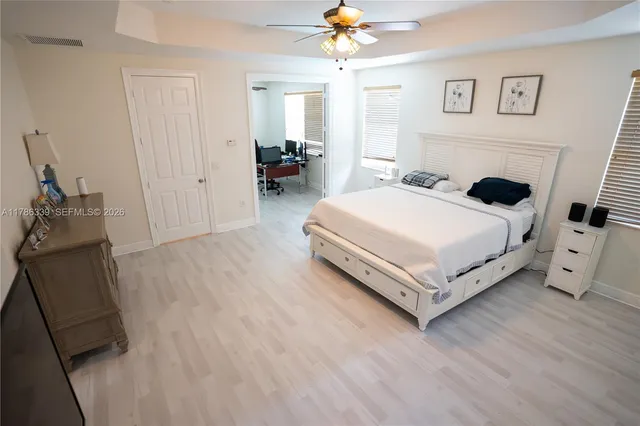 a bed room with a bed and a chair