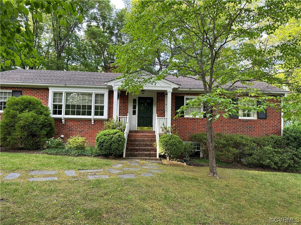 front view of a house with a yard