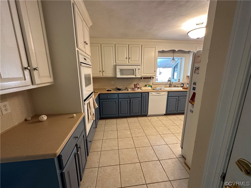 10254 Mannheim Drive Ashland, VA 23005 - Photo 17 of 43 a kitchen with a sink a stove top oven and cabinetry