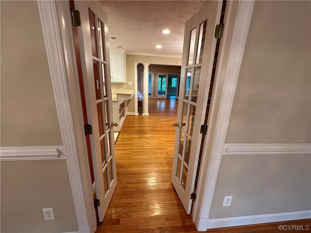 10254 Mannheim Drive Ashland, VA 23005 - Photo 20 of 43 a view of a hallway with wooden floor and staircase