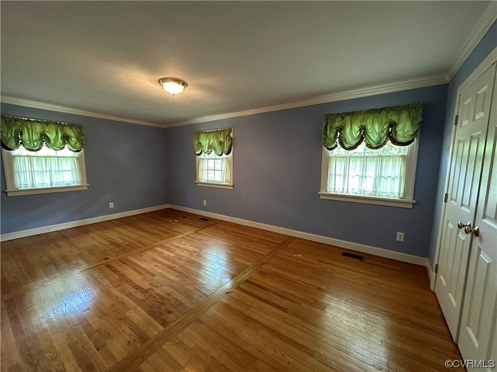 10254 Mannheim Drive Ashland, VA 23005 - Photo 26 of 43 an empty room with wooden floor and windows