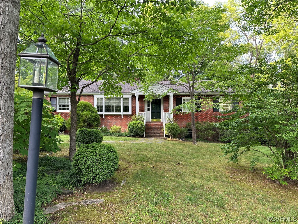 10254 Mannheim Drive Ashland, VA 23005 - Photo 42 of 43 a front view of a house with a yard
