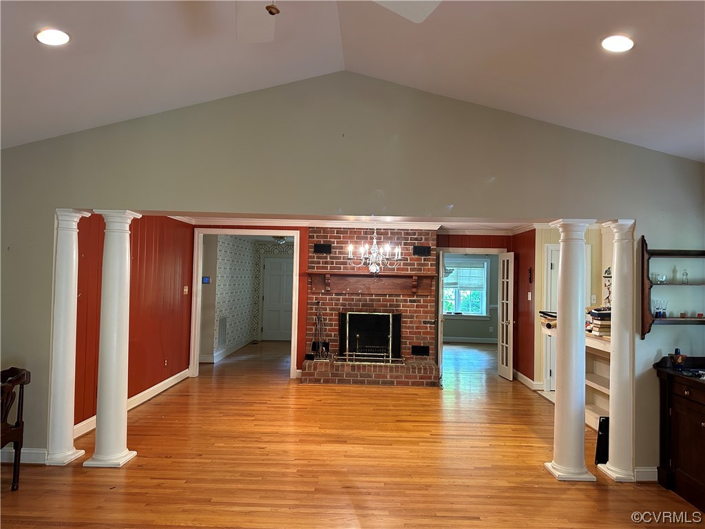 10254 Mannheim Drive Ashland, VA 23005 - Photo 8 of 43 an empty room with wooden floor fireplace and windows