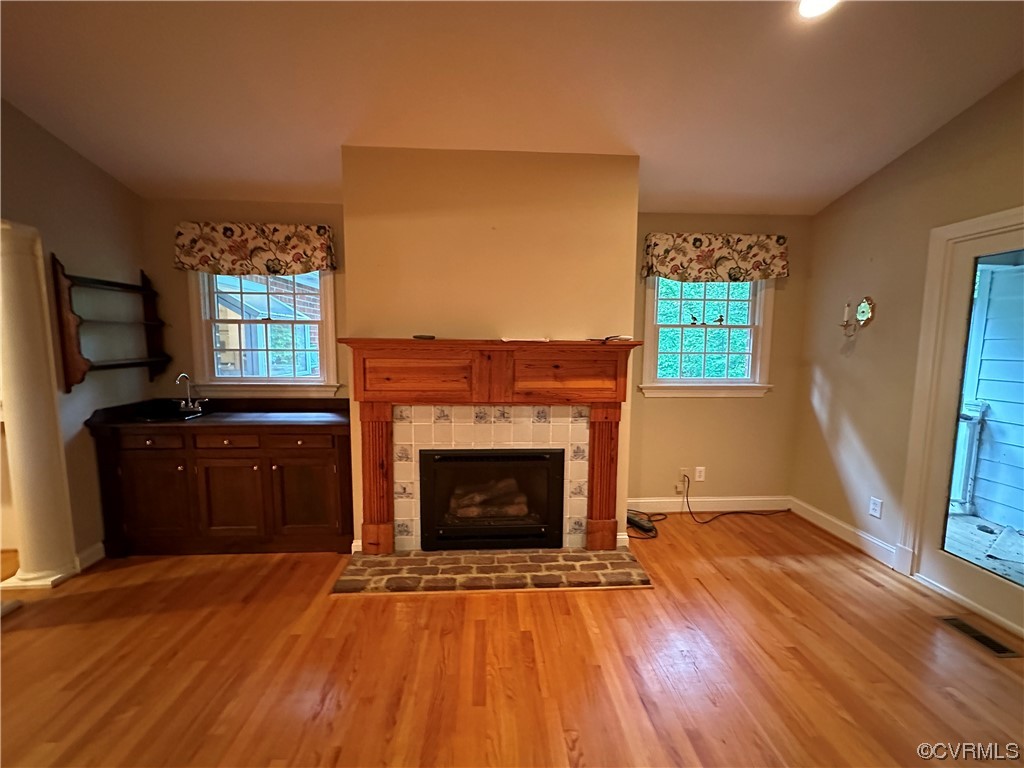 10254 Mannheim Drive Ashland, VA 23005 - Photo 10 of 43 a living room with a fireplace and a flat screen tv