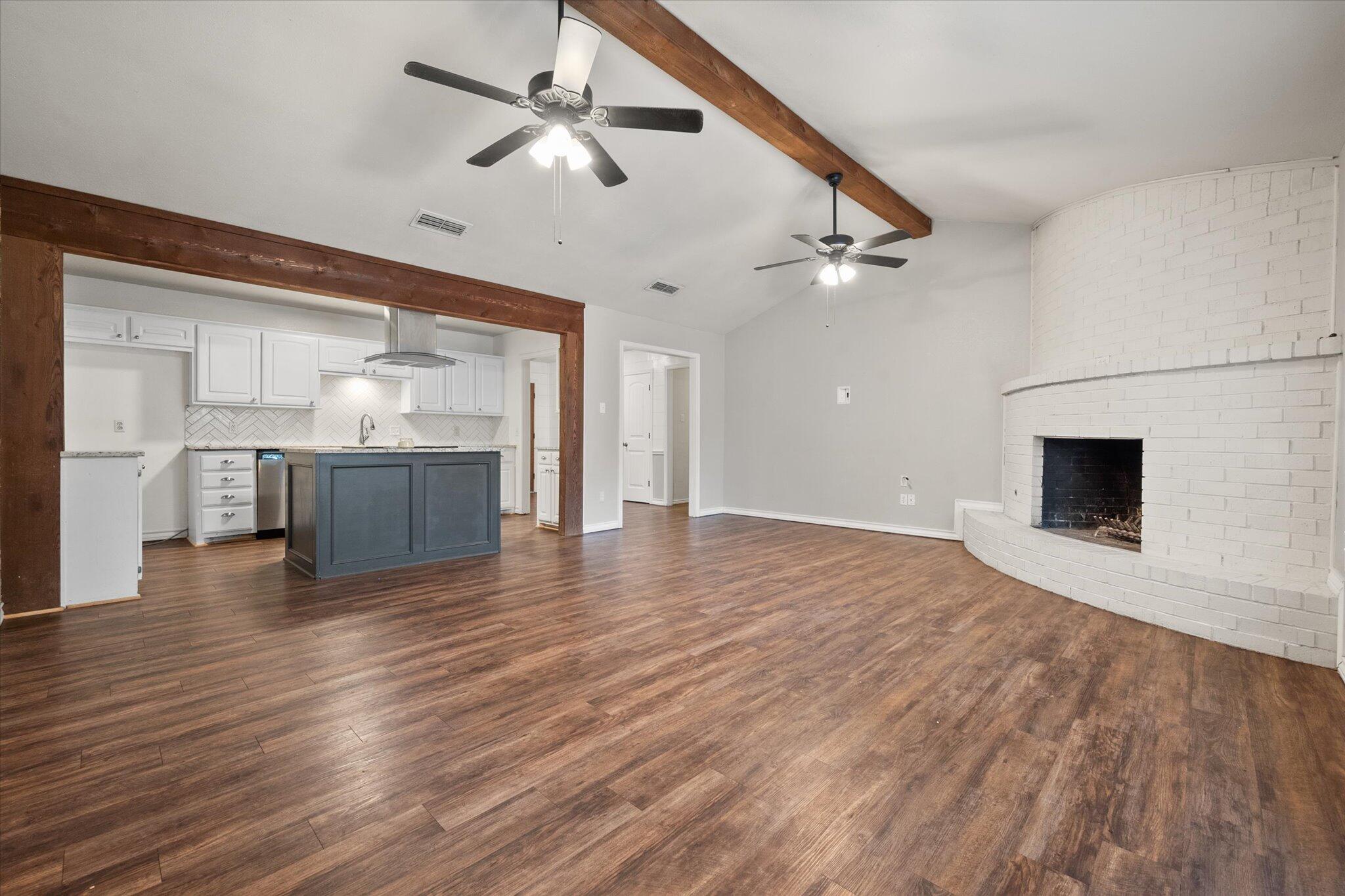 5309 77th Street Lubbock, TX 79424 - Photo 11 of 37 a view of empty room with wooden floor and ceiling fan