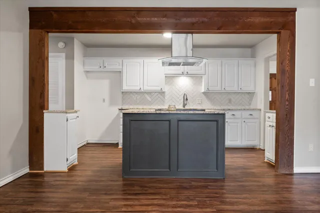 a kitchen with stainless steel appliances a refrigerator and cabinets