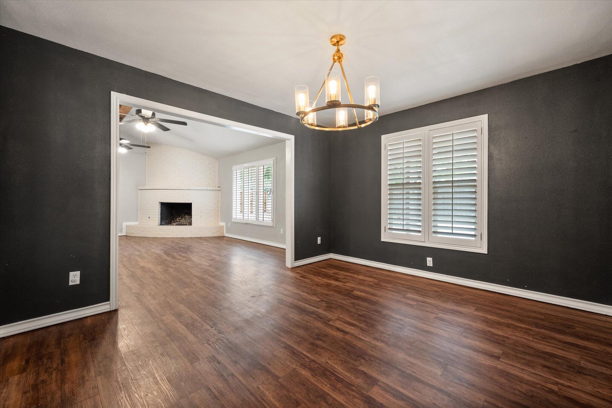 5309 77th Street Lubbock, TX 79424 - Photo 20 of 37 a view of livingroom with hardwood floor and window